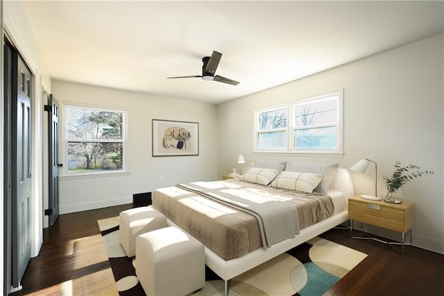 bedroom featuring dark hardwood / wood-style floors and ceiling fan