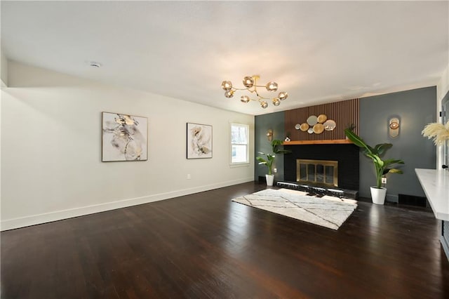 unfurnished living room with dark wood-type flooring