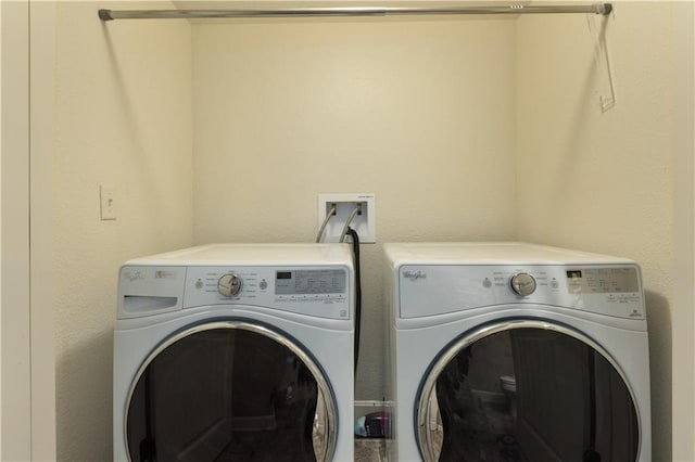 laundry room with washer and clothes dryer