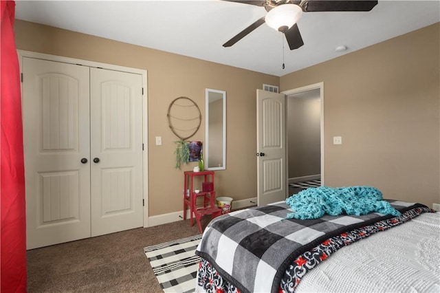 bedroom featuring ceiling fan, dark carpet, and a closet