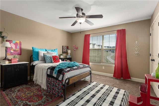 bedroom featuring ceiling fan and carpet