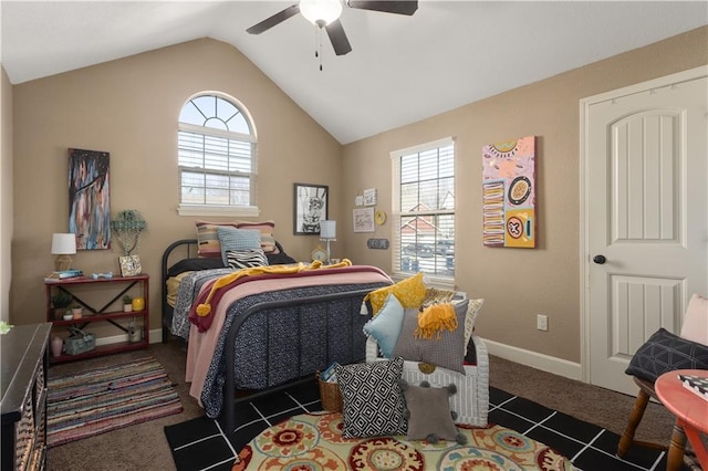 carpeted bedroom featuring vaulted ceiling and ceiling fan