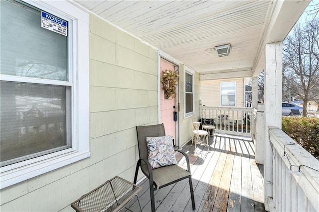 wooden terrace featuring a porch