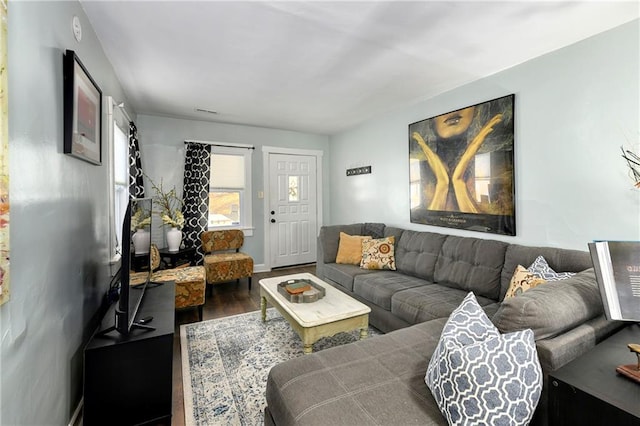 living room featuring dark hardwood / wood-style floors