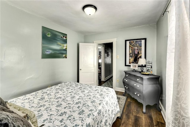 bedroom featuring dark wood-type flooring