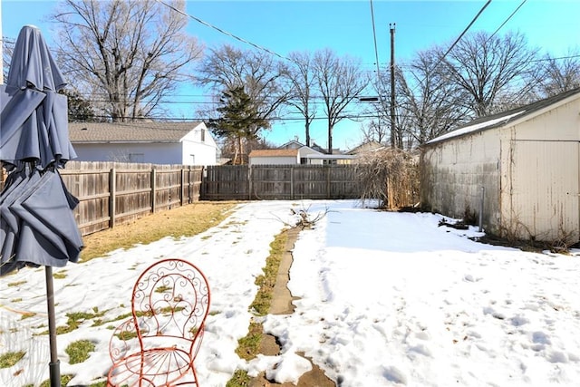 view of yard layered in snow