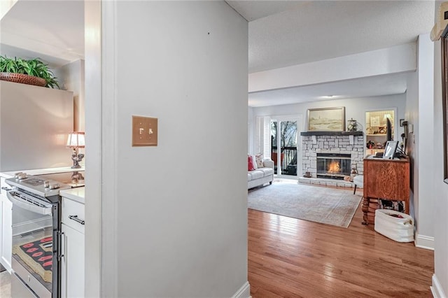 hall with light wood-type flooring