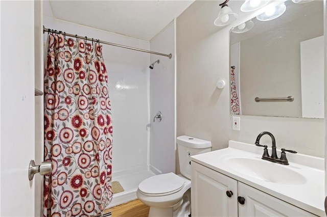 bathroom with a shower with curtain, vanity, toilet, and hardwood / wood-style floors