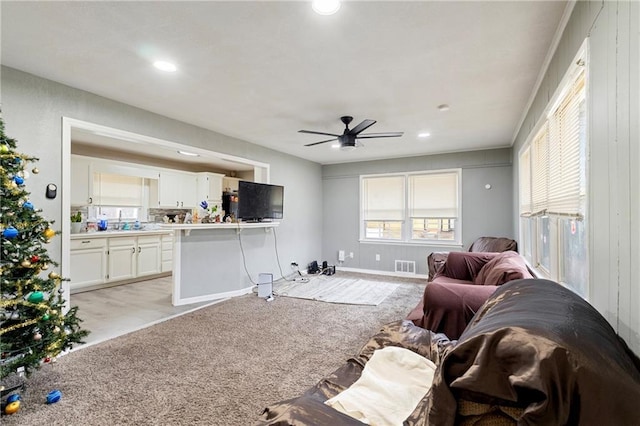 6133 Swope Pkwy, Kansas City, MO 64132 - living room featuring light carpet and ceiling fan