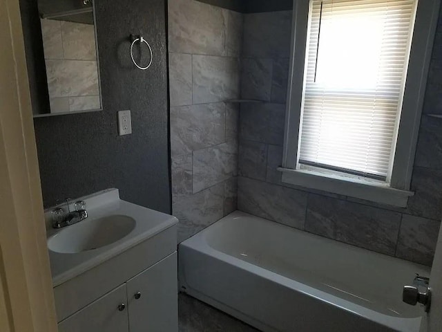 bathroom featuring vanity and  shower combination