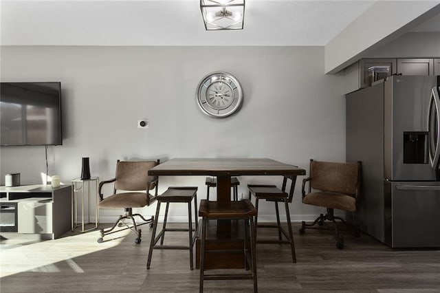 dining room with dark hardwood / wood-style floors