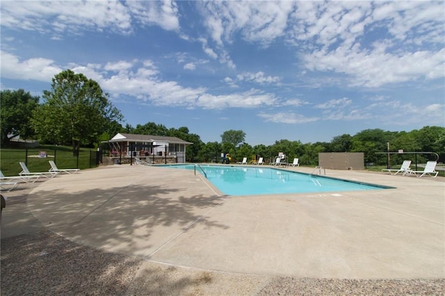 view of swimming pool featuring a gazebo and a patio