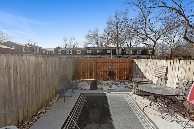 view of patio with outdoor dining area and a fenced backyard