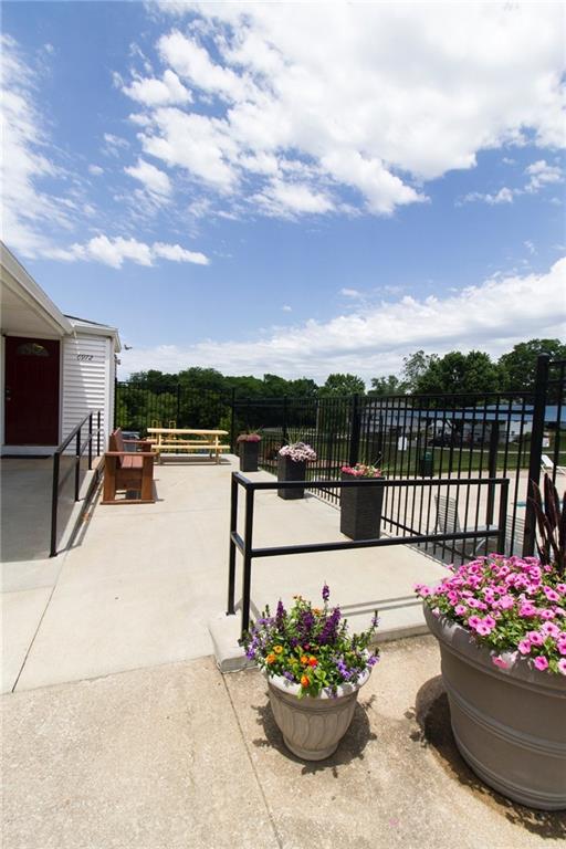 view of patio / terrace featuring fence