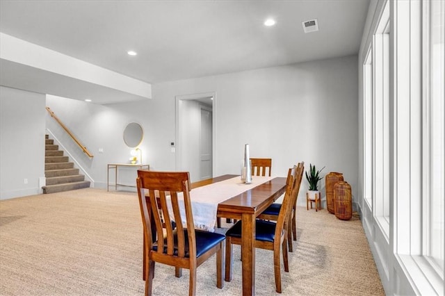 dining area with light colored carpet