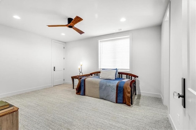 bedroom with light colored carpet and ceiling fan