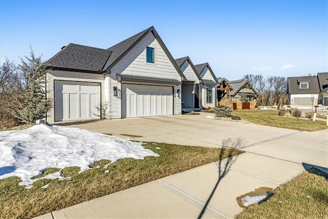 view of front facade featuring a garage and a front lawn