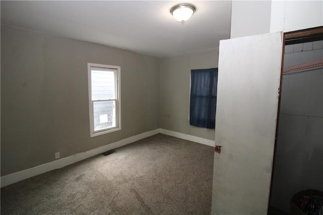 809 S 19th St, Saint Joseph, MO 64507 - spare room featuring baseboards and carpet