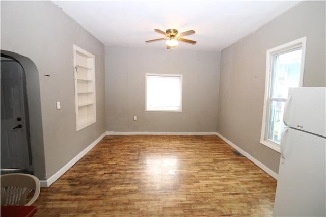 809 S 19th St, Saint Joseph, MO 64507 - spare room with a ceiling fan, built in features, a healthy amount of sunlight, and baseboards
