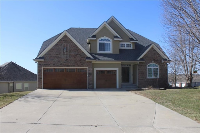 view of front facade featuring an attached garage, a shingled roof, a front lawn, concrete driveway, and brick siding