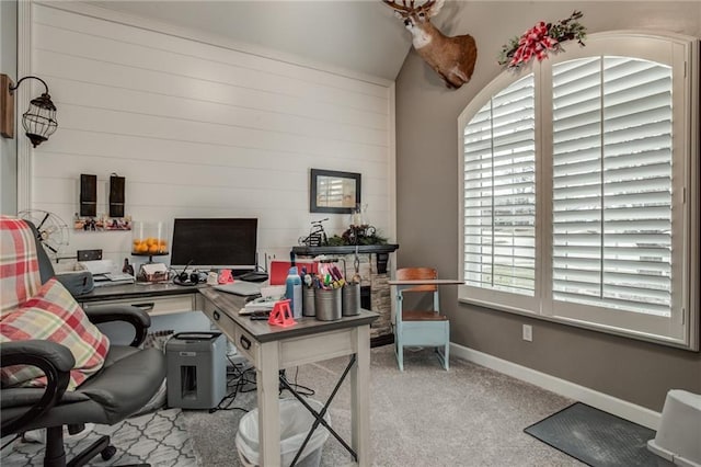 carpeted office space with baseboards