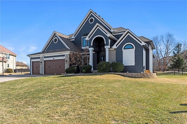 view of front of property with driveway, a front lawn, and fence