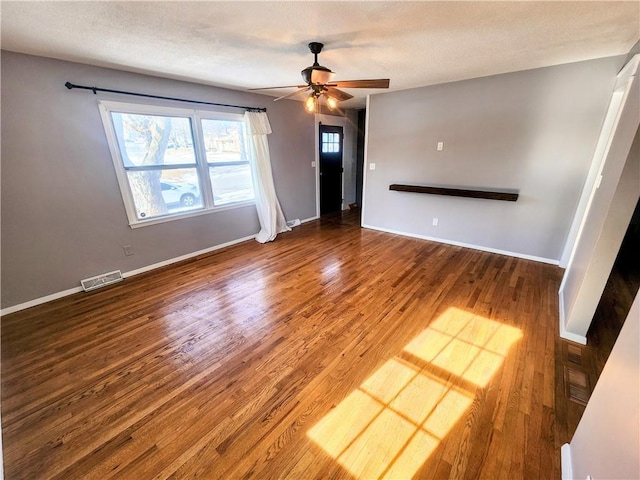 unfurnished living room with hardwood / wood-style flooring, a textured ceiling, and ceiling fan