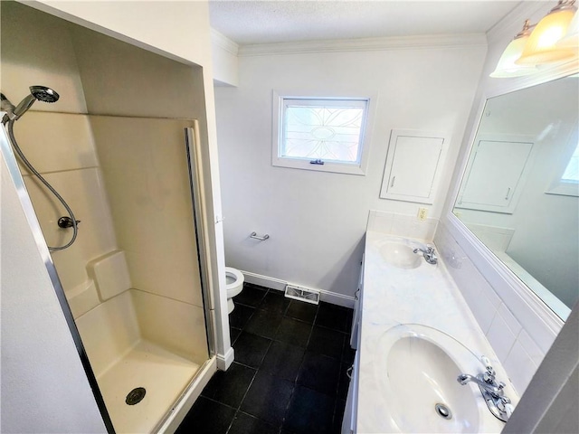 bathroom featuring walk in shower, ornamental molding, toilet, and vanity