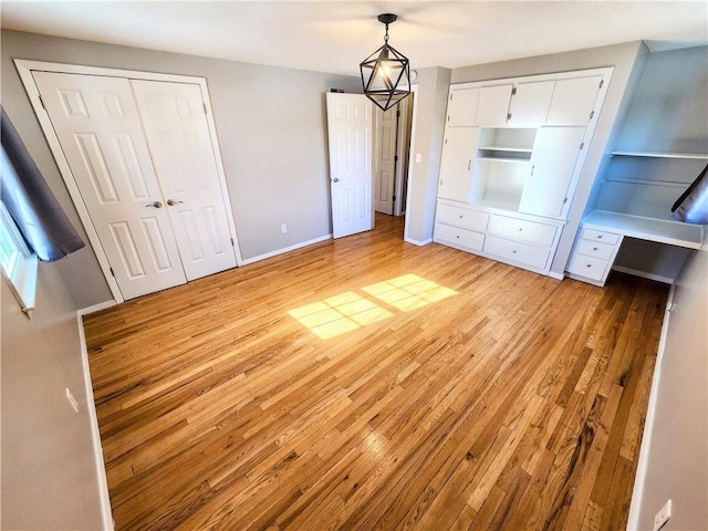 unfurnished bedroom with light wood-type flooring