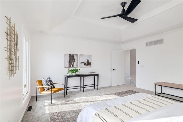 bedroom with a raised ceiling, ornamental molding, carpet flooring, and ceiling fan