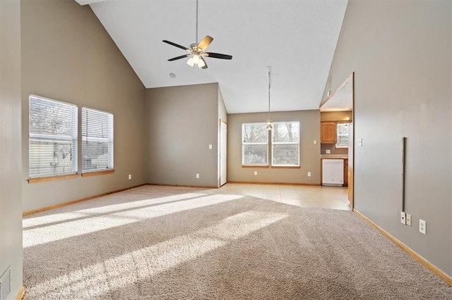 unfurnished living room with ceiling fan, light carpet, and high vaulted ceiling