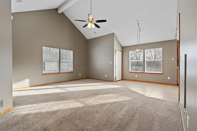 unfurnished living room featuring high vaulted ceiling, light colored carpet, beamed ceiling, and ceiling fan