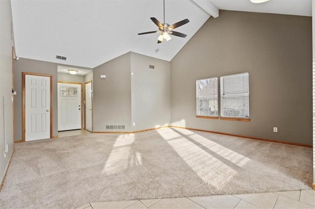 unfurnished living room with high vaulted ceiling, light colored carpet, and beamed ceiling