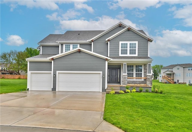 craftsman-style home with a garage, a front yard, and a porch