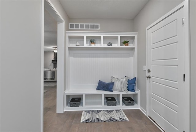 mudroom with hardwood / wood-style floors and ceiling fan