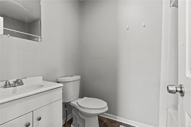 bathroom with vanity, a shower, tile patterned floors, and toilet