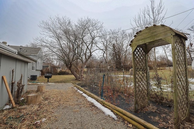 view of yard with central AC unit