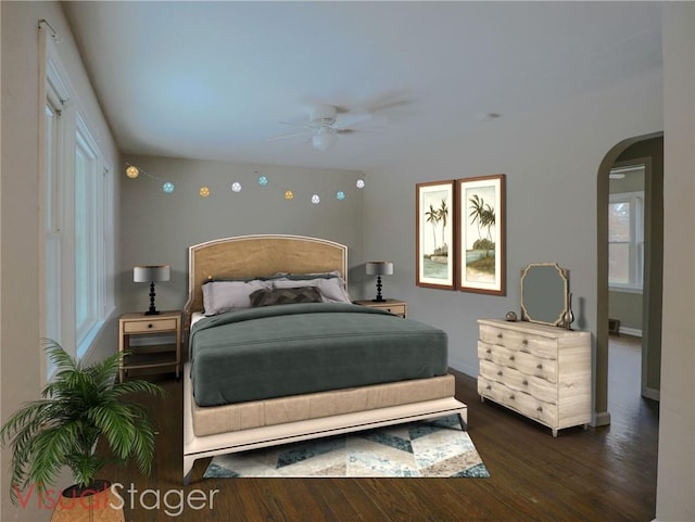 bedroom with arched walkways, dark wood-type flooring, and a ceiling fan