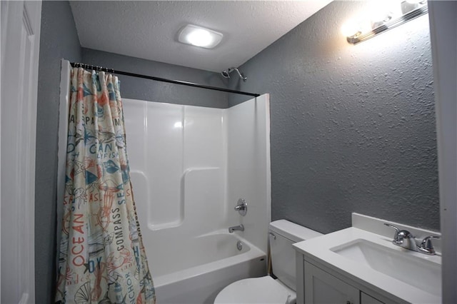 full bathroom featuring shower / bath combination with curtain, vanity, toilet, and a textured ceiling