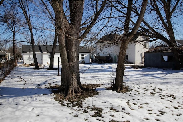 view of yard layered in snow