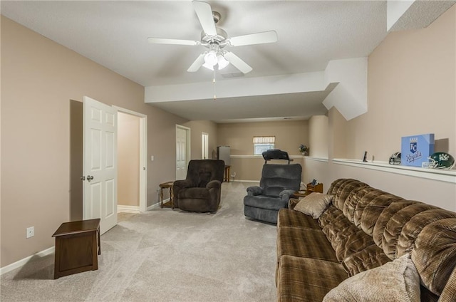 carpeted living room featuring ceiling fan