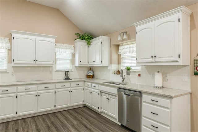 kitchen featuring white cabinets and dishwasher