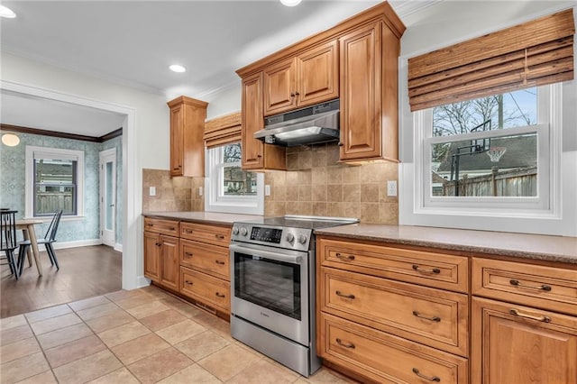 kitchen featuring crown molding, light tile patterned flooring, stainless steel range with electric cooktop, and backsplash