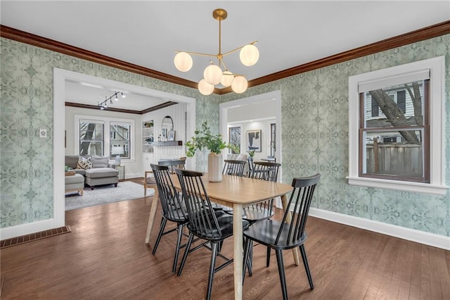 dining space featuring a notable chandelier, crown molding, and dark wood-type flooring