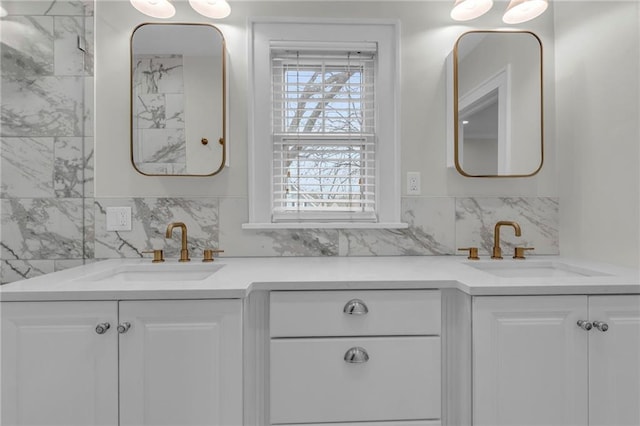 bathroom featuring tasteful backsplash and vanity