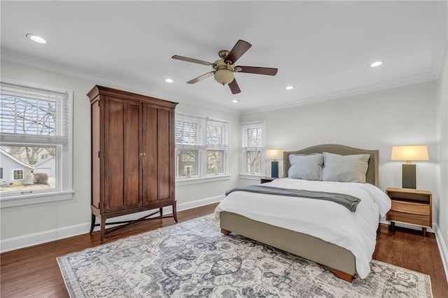 bedroom featuring multiple windows, crown molding, and dark hardwood / wood-style floors