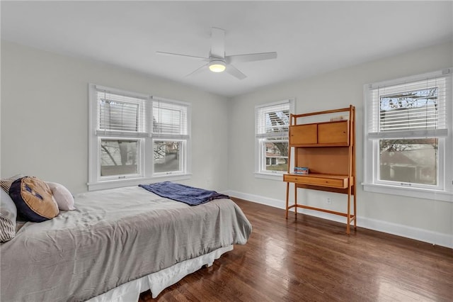 bedroom with dark wood-type flooring and ceiling fan