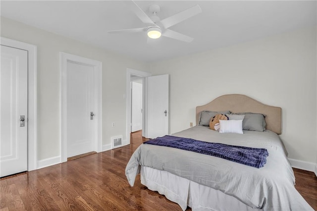 bedroom with ceiling fan and wood-type flooring