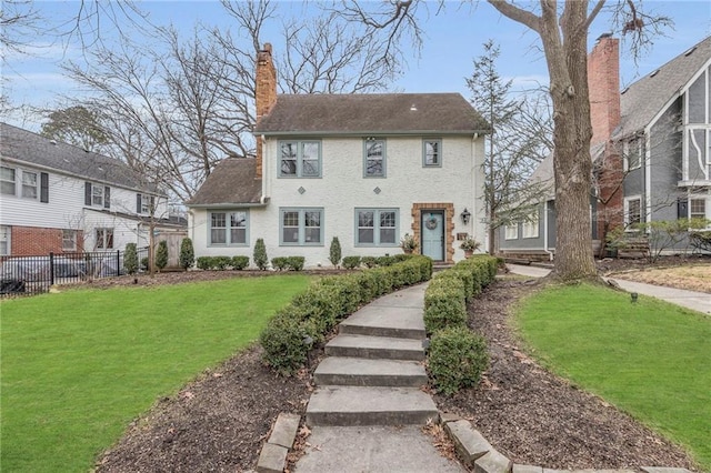 back of house featuring a yard