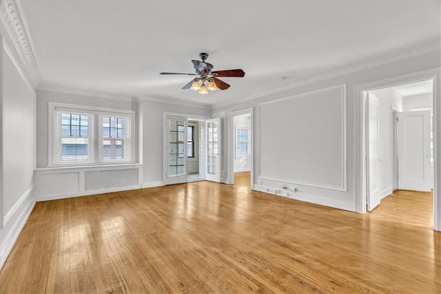 unfurnished room featuring crown molding, ceiling fan, and light hardwood / wood-style flooring